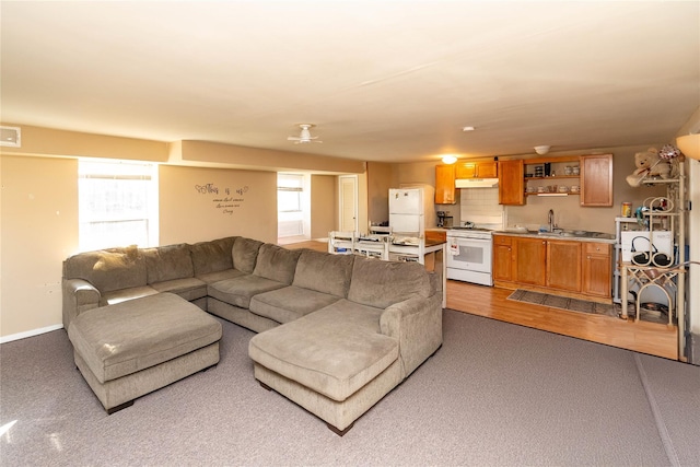 living room with visible vents and baseboards