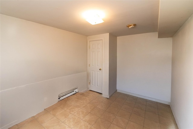 empty room with baseboards and a baseboard radiator