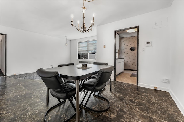 dining space with an inviting chandelier and baseboards