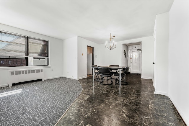 dining area with cooling unit, baseboards, radiator heating unit, and an inviting chandelier