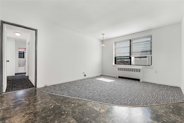 interior space with radiator, baseboards, and cooling unit