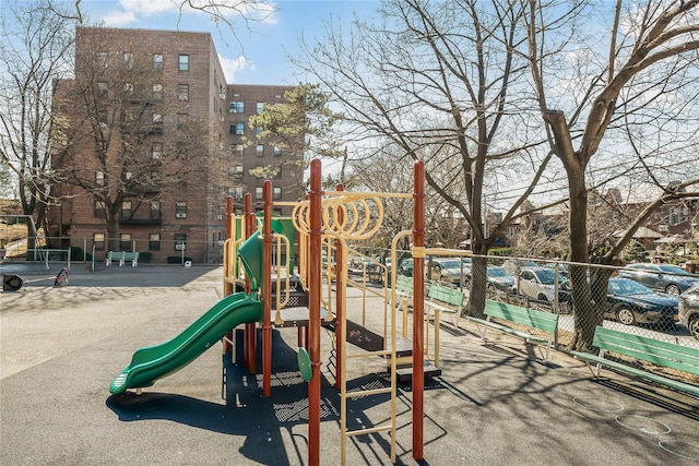 community jungle gym featuring fence