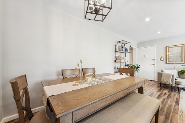 dining room featuring baseboards, an inviting chandelier, wood finished floors, and recessed lighting