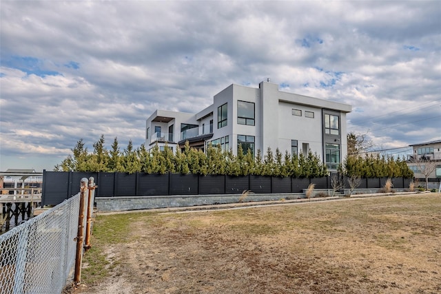 view of building exterior with fence