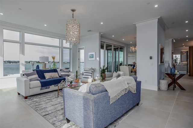 tiled living area featuring crown molding, plenty of natural light, recessed lighting, and an inviting chandelier