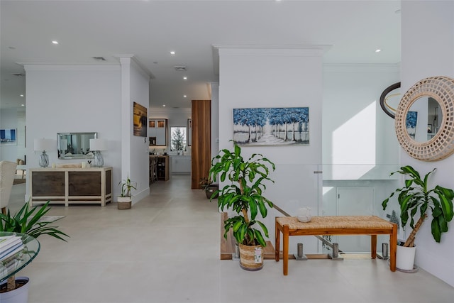 hall with visible vents, crown molding, and recessed lighting