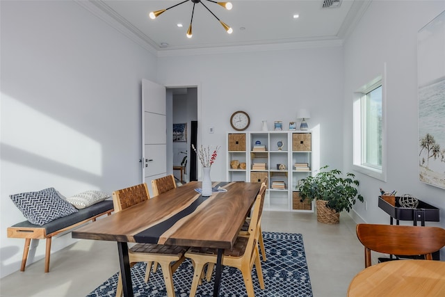 dining area with an inviting chandelier, finished concrete floors, visible vents, and crown molding