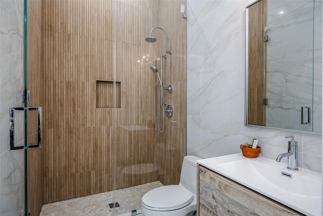 bathroom featuring a stall shower, tasteful backsplash, toilet, vanity, and tile walls