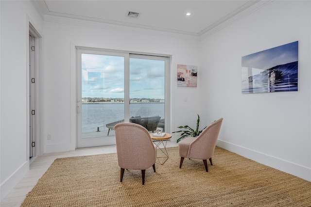 dining area featuring baseboards, visible vents, a water view, crown molding, and recessed lighting