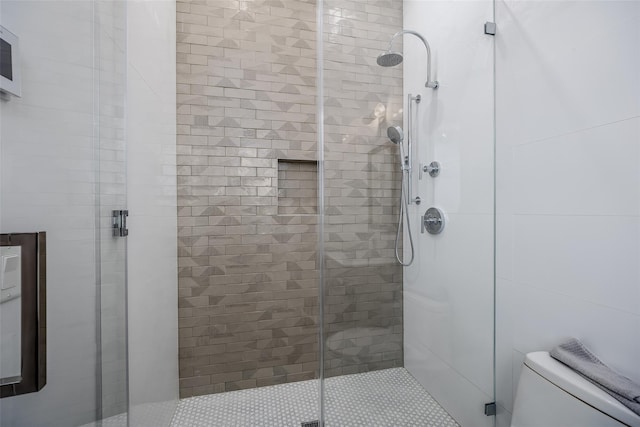 full bath with a shower stall and toilet