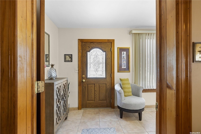 entryway with light tile patterned floors