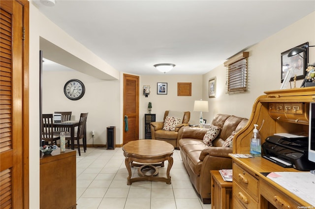 living room featuring light tile patterned floors and baseboards