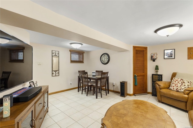 living room featuring light tile patterned floors and baseboards