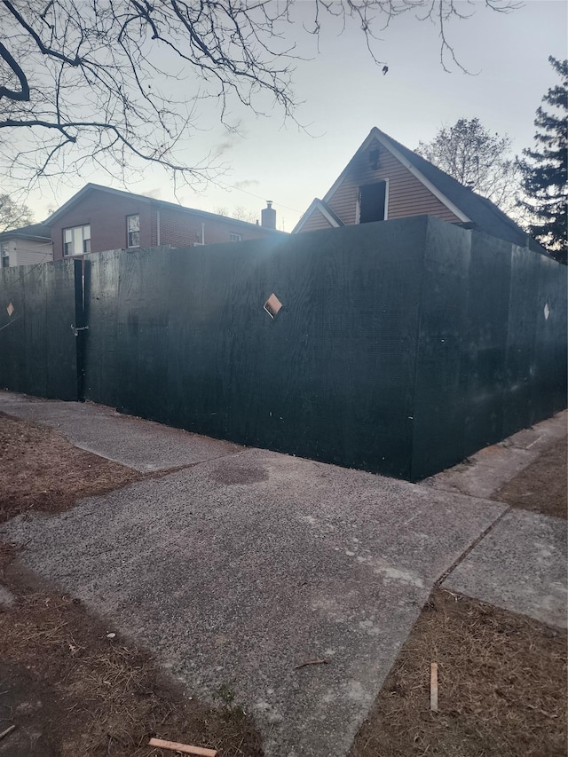 view of property exterior with fence