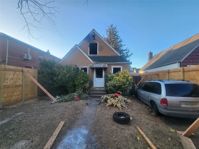 view of front of house featuring fence