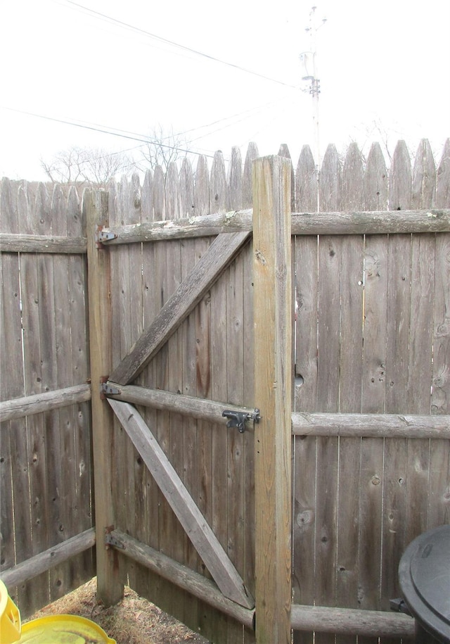 view of gate featuring fence