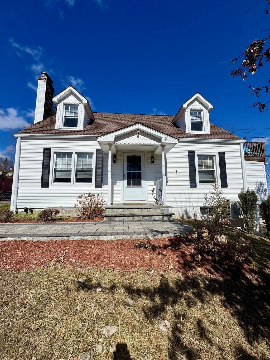 view of front of home with a chimney