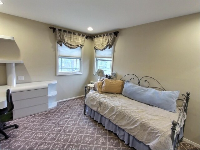 bedroom featuring carpet flooring and baseboards