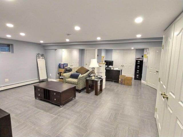 living room featuring baseboards, a baseboard heating unit, and recessed lighting