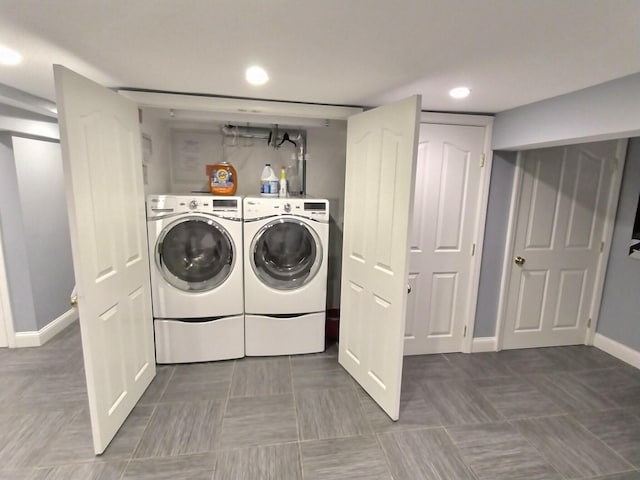 washroom with laundry area, separate washer and dryer, recessed lighting, and baseboards