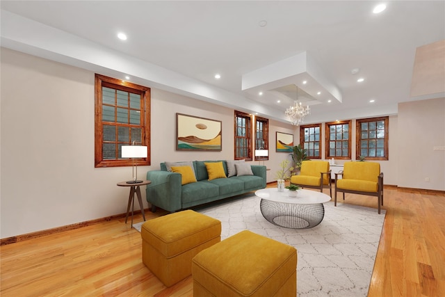 living area featuring recessed lighting, baseboards, and light wood-style floors