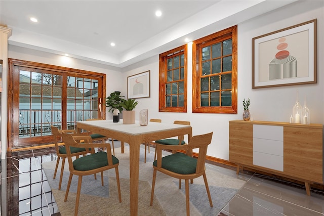 dining space featuring recessed lighting and baseboards