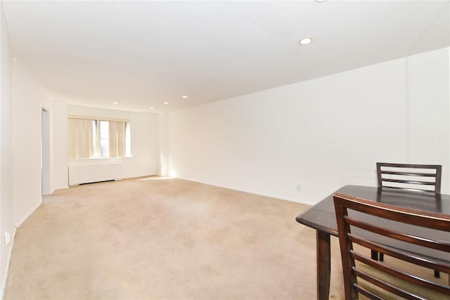 spare room featuring light carpet and recessed lighting