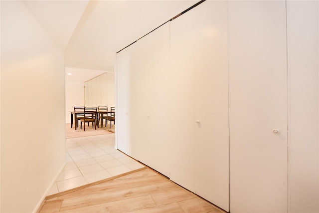 hallway with light wood-style floors