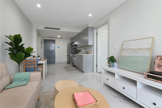 living room featuring recessed lighting, marble finish floor, and visible vents