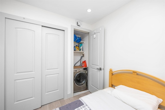 41-62 Bowne St Unit 12G, Flushing, NY 11355 - bedroom with recessed lighting, a closet, light wood-style floors, and washer / clothes dryer