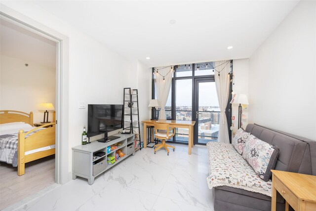41-62 Bowne St Unit 12G, Flushing, NY 11355 - living area featuring recessed lighting and marble finish floor