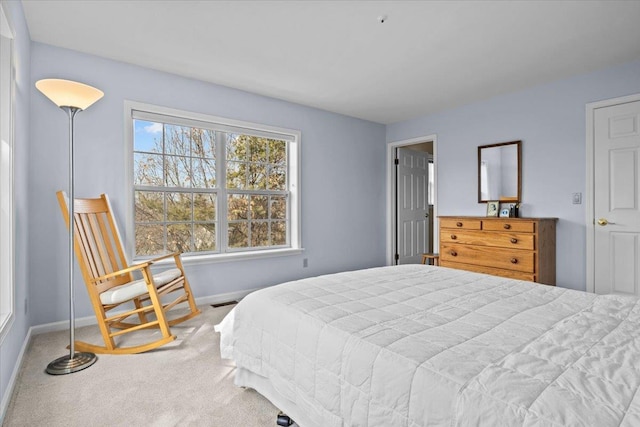 bedroom featuring baseboards and carpet floors