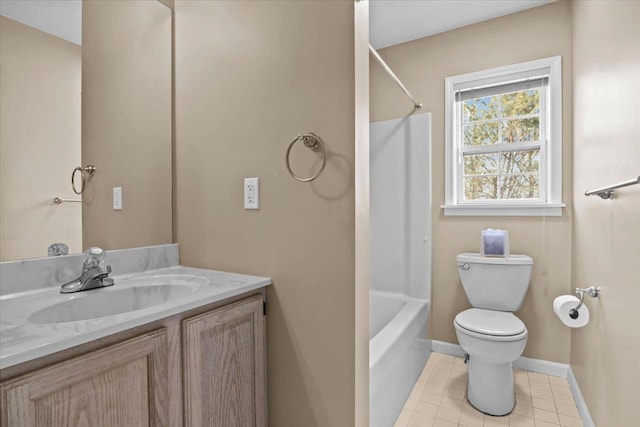 bathroom with vanity, baseboards, tile patterned flooring, shower / washtub combination, and toilet