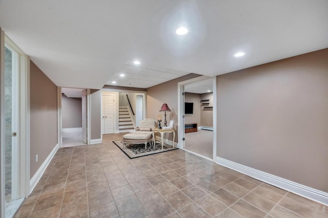 interior space featuring tile patterned flooring, baseboards, stairway, baseboard heating, and recessed lighting