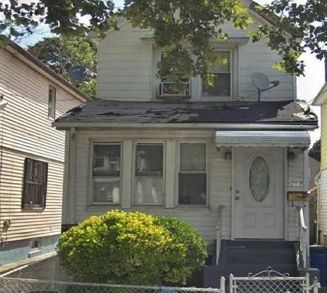 131-05 135th St, Ozone Park, NY 11420 - doorway to property featuring fence