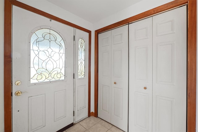 entryway featuring light tile patterned floors