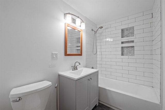 bathroom with vanity, toilet, and shower / bathtub combination