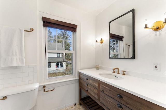 bathroom with vanity and toilet