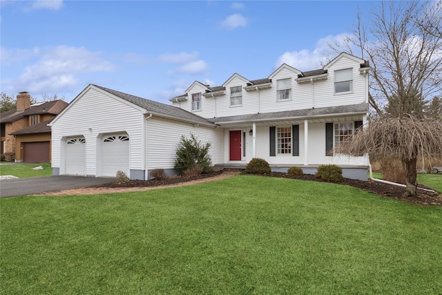 view of front of home with a front yard, roof with shingles, a porch, a garage, and aphalt driveway