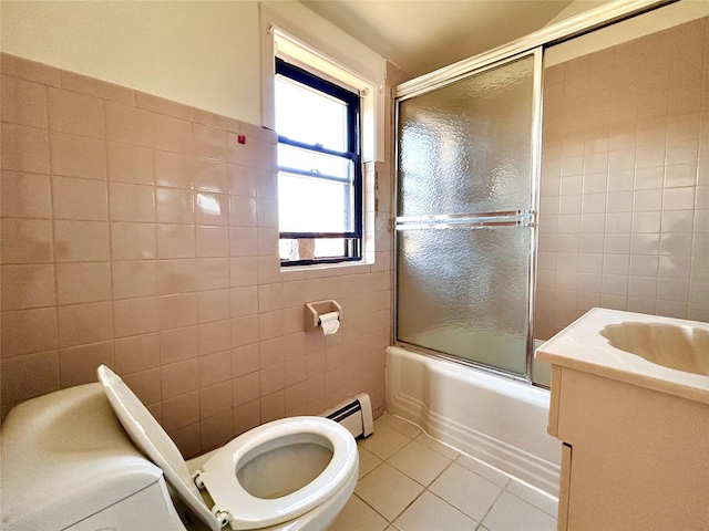 full bathroom featuring tile patterned flooring, shower / bath combination with glass door, tile walls, and a baseboard radiator