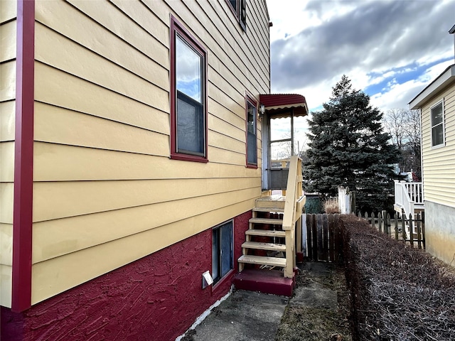 view of property exterior with fence