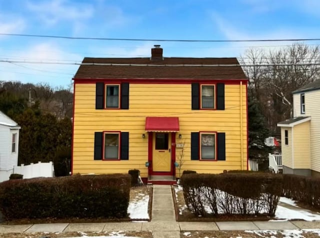 view of front of property with a chimney