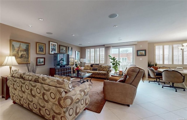 living room with light tile patterned floors, plenty of natural light, and recessed lighting