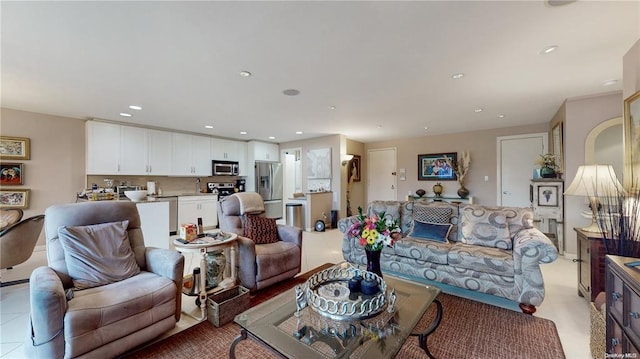 living room with baseboards and recessed lighting