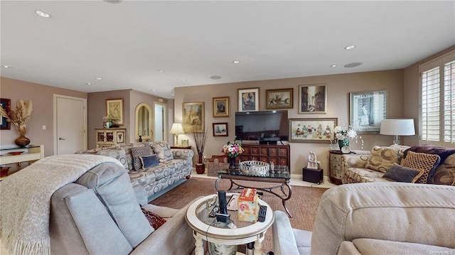 living room with recessed lighting and baseboards