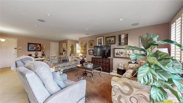 living room featuring light tile patterned flooring and recessed lighting