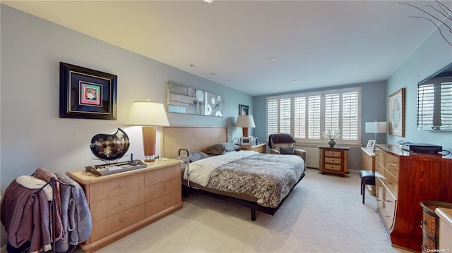 bedroom with light colored carpet