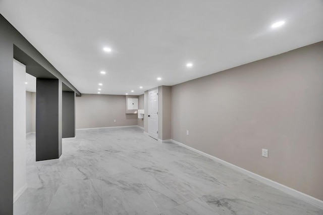 finished basement with recessed lighting and baseboards