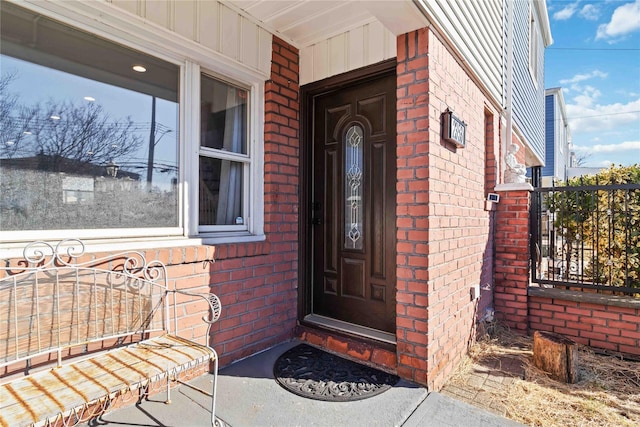 entrance to property with brick siding