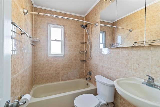 full bathroom with crown molding, toilet, shower / bath combination, tile walls, and a sink